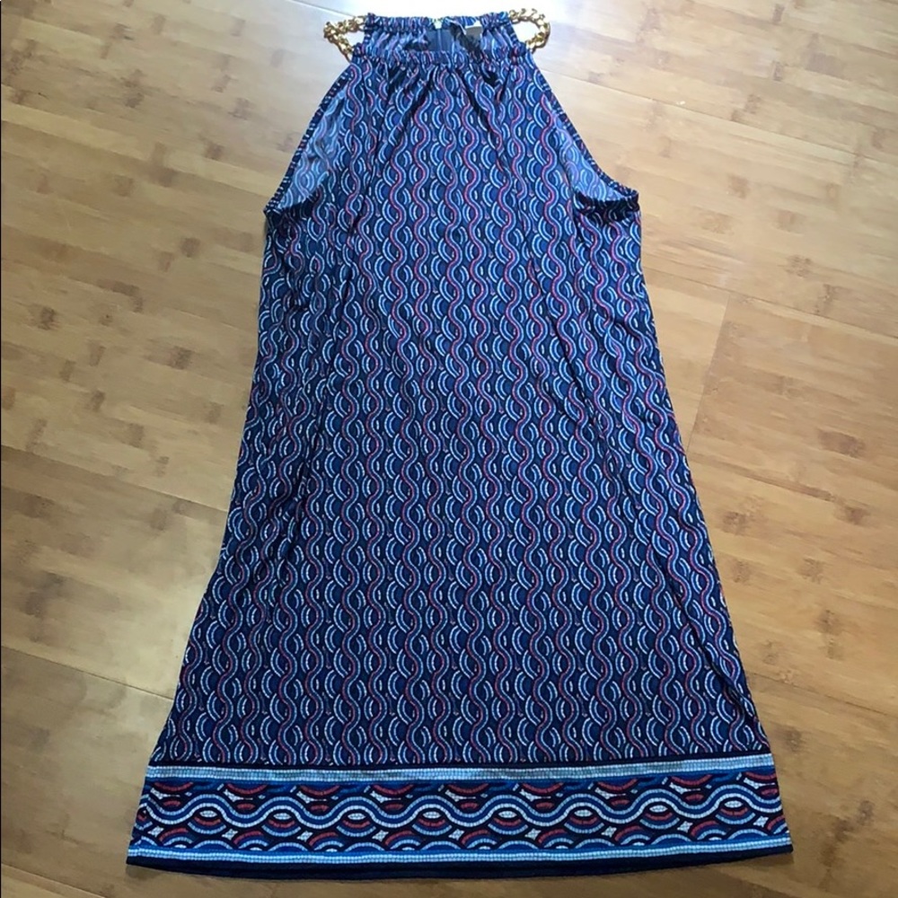 Loose fitting blue dress with gold chain neck.